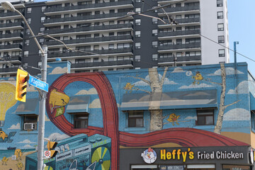 Naklejka premium mural and sign on the side of Heffy's Fried Chicken, a restaurant, located at 1054 Kingston Rd (at Victoria Park Av), Scarborough, Toronto