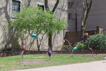 Naklejka premium view of Toronto Sculpture Garden, feat work by Chloe Begg, called Waiting Rooms and Roller Coasters at 115 King St E
