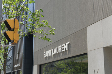 Naklejka premium exterior building and sign of Saint Laurent, a luxury clothing store, located here at 110 Bloor St W, Toronto