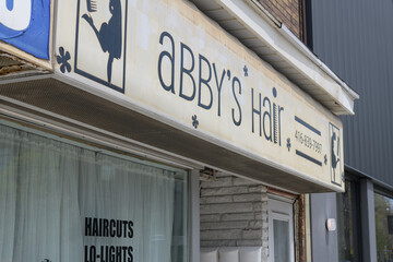 Naklejka premium exterior building and sign of Abby's Hair at 708 Kingston Rd, Toronto