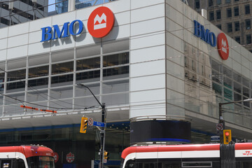 Naklejka premium BMO, Bank of Montreal Financial Group corporate logo at northwest corner of King St W and Bay St at First Canadian Place, Toronto