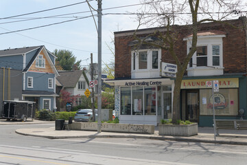 Naklejka premium exterior building and sign of Active Healing Centre, a massage therapist, located at 937 Kingston Rd, Toronto (and old Laundromat)