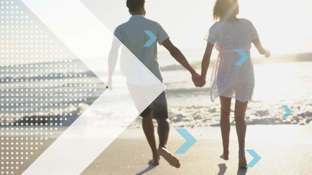 Pair holding hands leaving sand, running and jumping into surf as arrow or chevrons moving for ads