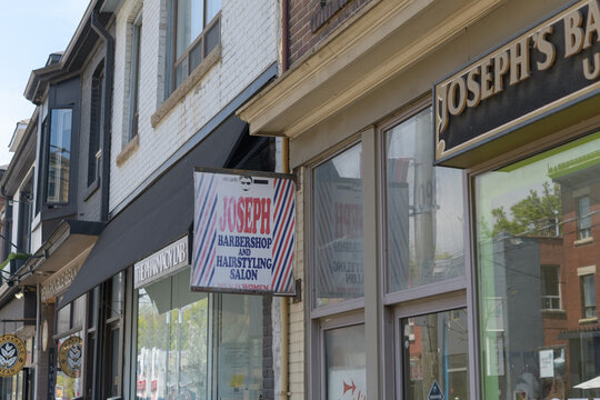 exterior signs at Joseph's Barber Shop located at 1099 Queen St E, Toronto