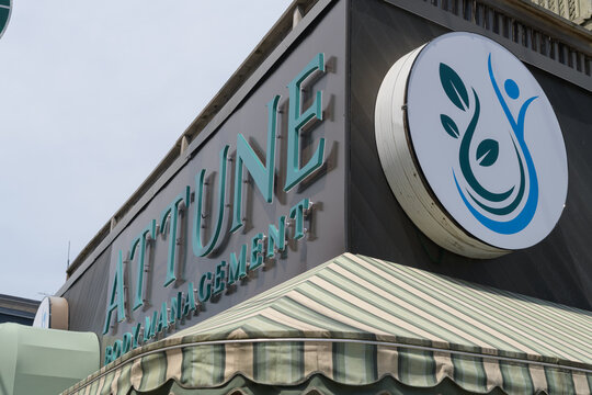 exterior building facade and sign of Attune Body Management, a wellness center, located at 886 Kingston Rd, Toronto