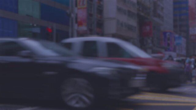 Intentionally blurred daytime view of a busy Hong Kong city intersection, defocus