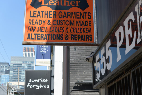 old projecting sign outside Perfect Leather Goods Ltd located at 555 King St W, Toronto