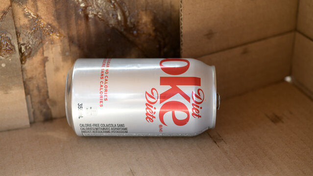discarded can of Diet Coke inside a cardboard box, Toronto