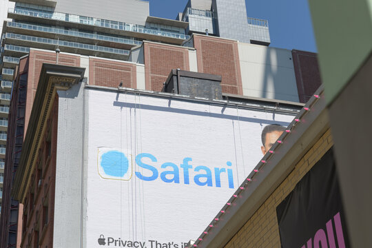 painted mural on west facing wall of 409 King St W for Apple Inc Safari web browser, southeast corner of Spadina Av, Toronto