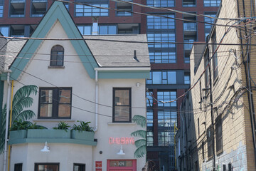 Naklejka premium exterior building and neon sign of Chubby's Jamaican Kitchen located at 104 Portland St, Toronto