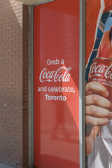 Naklejka premium vinyl window sign for Coca-Cola outside JC Foodlane, a convenience store, located at 270 Wellington St W inside The Icon, Toronto