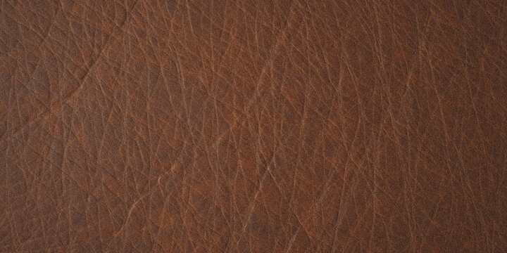 Close-up texture of dark brown cracked soil with dry earth pattern in natural outdoor setting