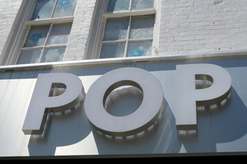 Naklejka premium sign outside Pop Core Toronto (324 Queen St W)