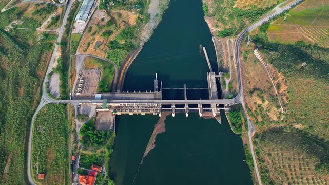 Hydroelectric power plant overview showing dam structure, river, and energy generation process