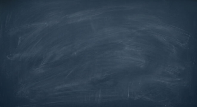 Empty chalkboard background with chalk traces dark blue school blackboard texture with copy space for text or design