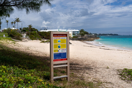 Smith&rsquo;s Parish, Bermuda - April 19, 2026: This sign at John Smith's Bay Beach gives information about possible rip currents, Portuguese Man-Of-War, and warning flags that may be displayed.