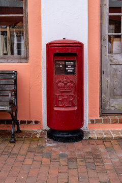 St. George's, Bermuda - April 19, 2026: This vintage red Royal Mail postbox is an iconic, functional heritage landmark in Bermuda