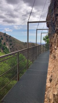Hiking trail to Colgante bridge (Puente Colgante El Saltillo) over Almanchares river, Sierra Tejeda, Andalusia, Spain