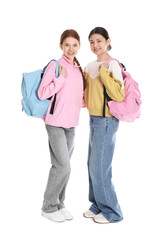 Obraz premium Portrait of teenage girls with backpacks on white background