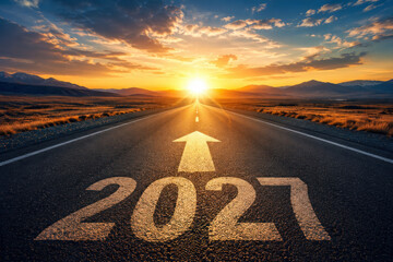 Fototapeta premium Open Road Toward Bright Sunset with 2027 Year Marking and Forward Arrow Concept