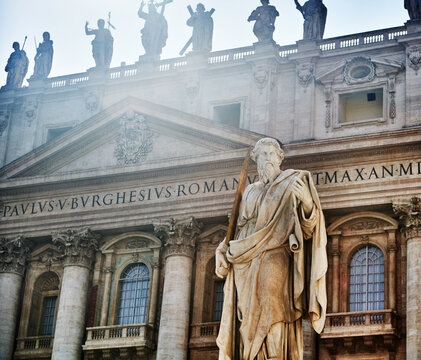 Statue of st. Paul (1847) in front of the main facade (17th century) of St. Peter's Basilica in Vatican City, Rome, Italy, Europe 