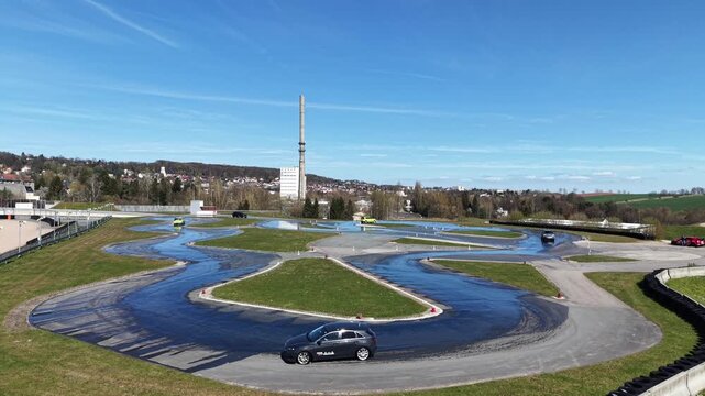 Aerial Wide View of Driving Safety Training Center with Skid Pads and Cars
