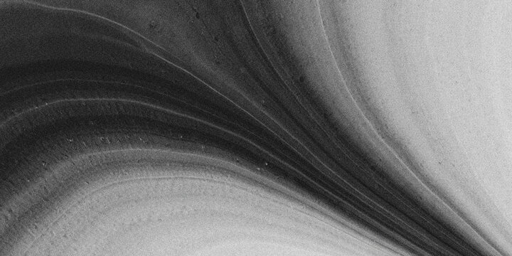Close-up black and white texture of rough concrete surface with deep cracks and shadows