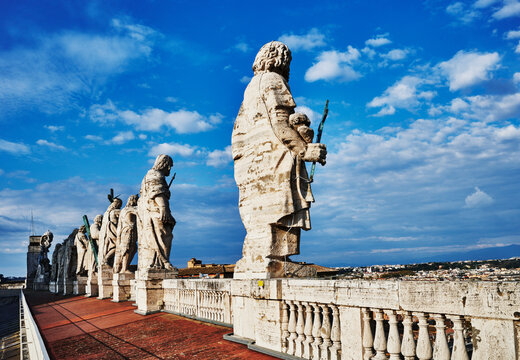 Eleven massive statues of the saints and apostles (sculpted between 1612 and 1614.) standing on the roof of St. Peter's Basilica in Vatican City, Rome, Italy, Europe 