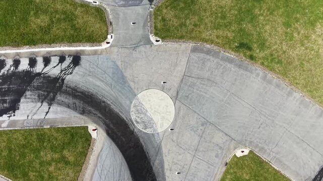 Aerial Top Down View of Car on Driving Course Corner with Tire Marks