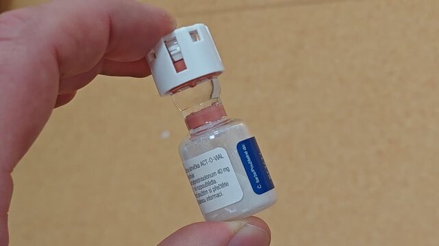 Glass ampoule with injection solution blocked by rubber stopper pharmaceutical manufacturing failure