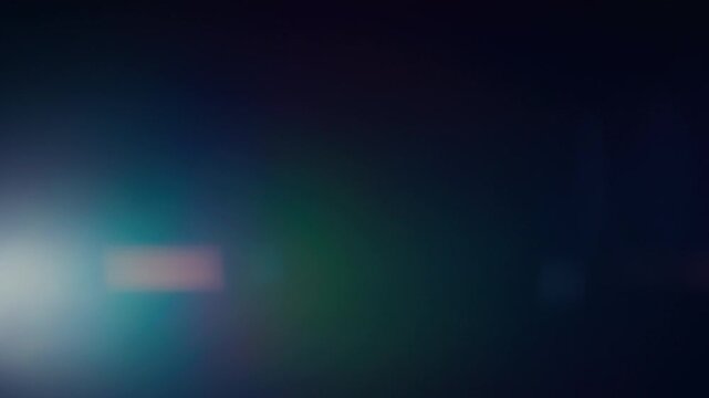 Abstract green and purple anamorphic lens flares and light leaks
