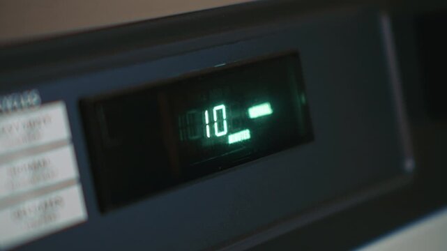 Digital dryer display showing remaining drying time highlighting operation of a modern household appliance