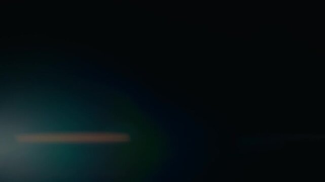 Bright green anamorphic lens flares with warm horizontal light
