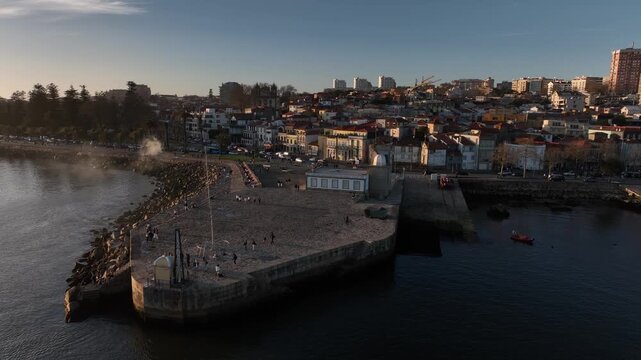 Drone Footage of Foz do Douro Waterfront in Porto Portugal During a Golden Sunset