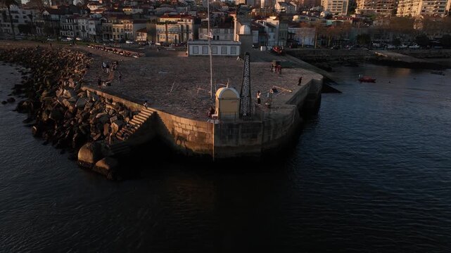 Drone Footage of Foz do Douro Waterfront in Porto Portugal During a Golden Sunset