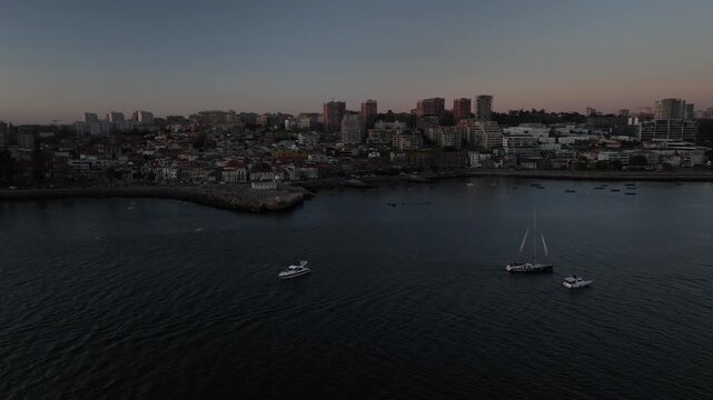 Aerial Cinematic View of Sailing Vessels at Sunset in Foz do Douro Porto Portugal Coast