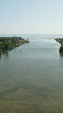 Cinematic Aerial View of a River Flowing Into the Pacific Ocean on the Oaxaca Coast Mexico