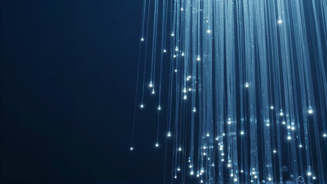 Glowing fiber optic strands cascade down dark blue background