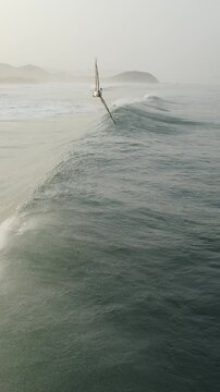 Cinematic Aerial Close Up of Ocean Wave Formation With Flying Birds
