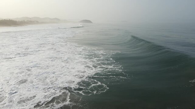 Cinematic Aerial Close Up of Ocean Wave Formation With Flying Birds