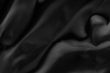 Fototapeta premium Black fabric texture for background; Abstract black fabric cloth wave or wavy folds texture material for background