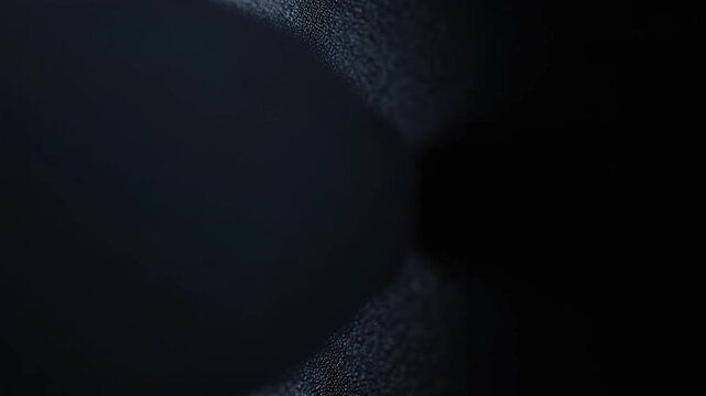 A dark and moody texture with a black hole-like shape in the center, evoking a sense of mystery and intrigue.
