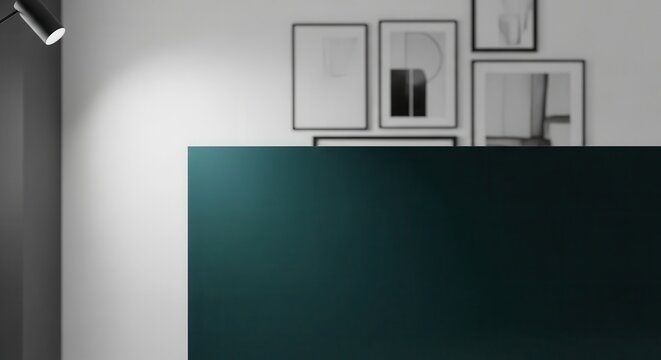 A dark teal ultra matte lacquer finish on a modern furniture surface with framed art on the wall in the background