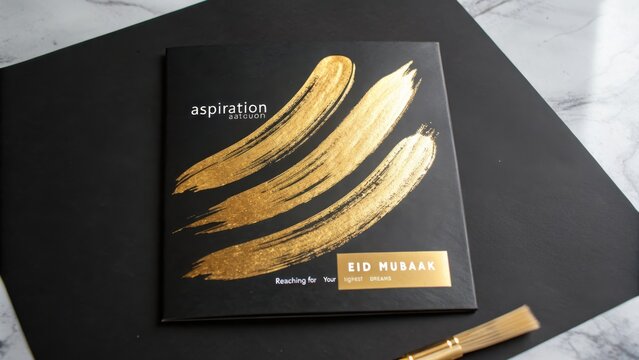 Elegant Eid Mubarak Card with Gold Brushstroke Design