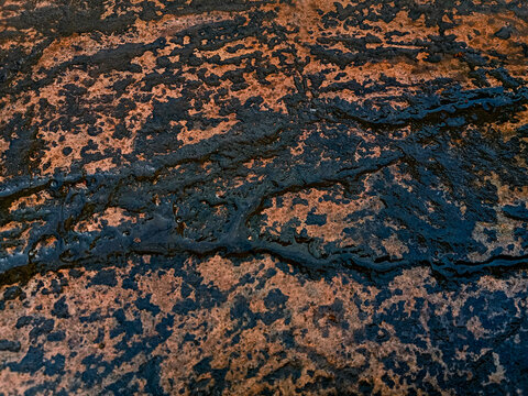 Close up textured background of natural granite rock surface