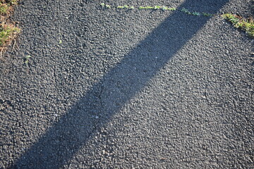 Fototapeta premium Abstract asphalt road background with morning light and shadow