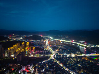 Fototapeta premium Aerial view of the illuminated city landscape in Jianou City located in Nanping Fujian Province China at night
