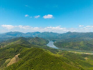 Obraz premium An aerial view of the lush green Wuyi Mountains and a winding river in Fujian China