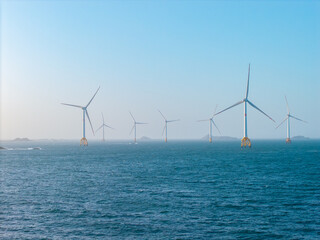 Offshore wind turbines generate renewable energy across the coastal sea waters of Pingtan in Fujian China © AS_SleepingPanda