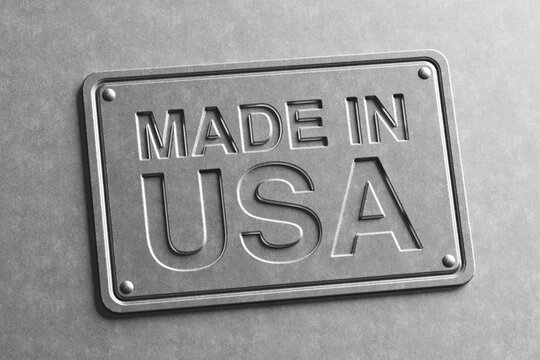 American Manufacturing Quality And Domestic Production Concept. Embossed Made In USA Metal Plate On Gray Industrial Background. 3d Rendering